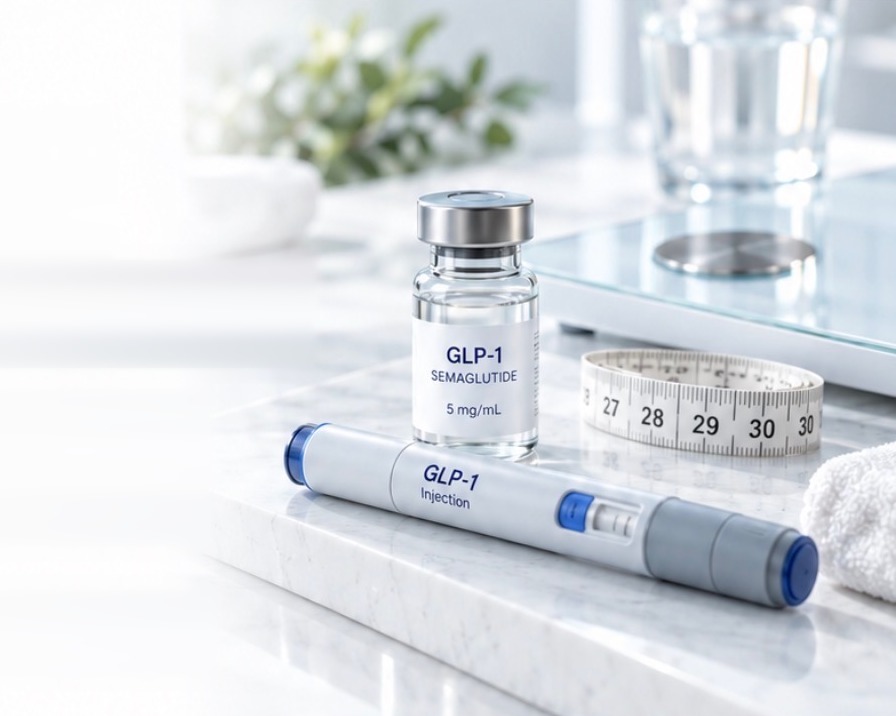 GLP-1 vial and injection pen beside a measuring tape